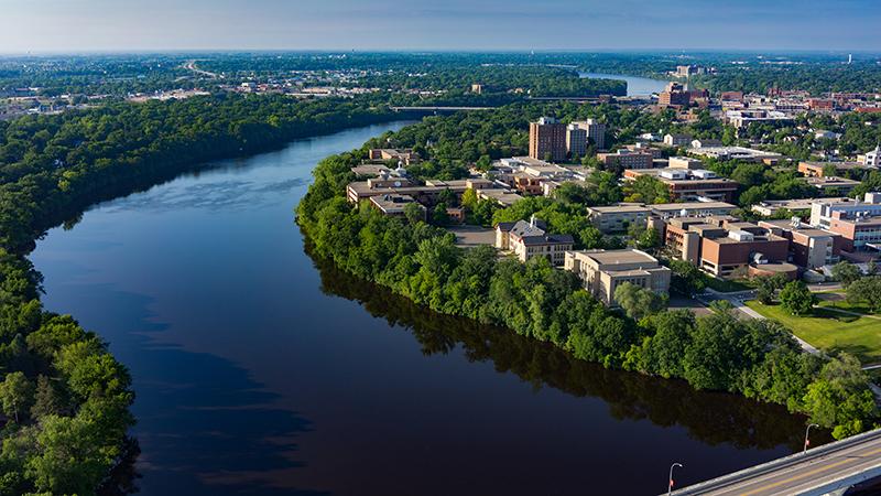 Aerial view of river and campus