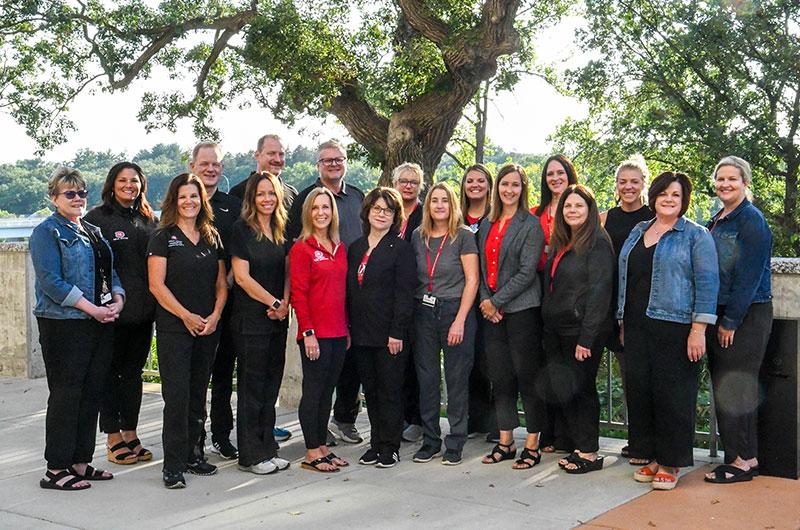 the Medical Clinic and Counseling team outside on a sunny day